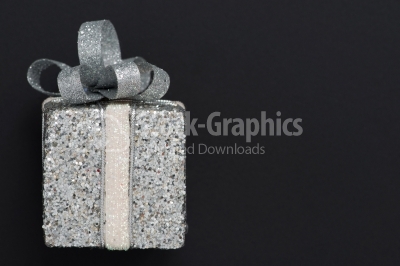 Gift box with silver ribbon bow
