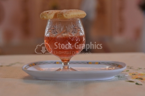 Glass of wine with snack on top