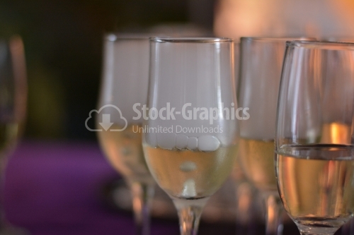 Glasses with cold champagne and carbonated ice