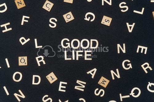 GOOD LIFE word written on dark paper background. GOOD LIFE text for your concepts