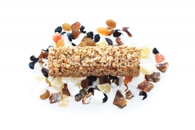 Granola bar with dried fruits on white background