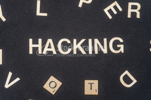 HACKING word written on dark paper background. HACKING text for your concepts