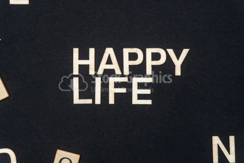 HAPPY LIFE word written on dark paper background. HAPPY LIFE text for your concepts