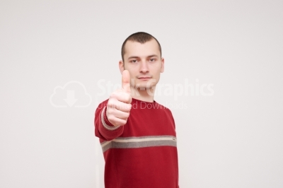 Happy man giving thumbs up sign