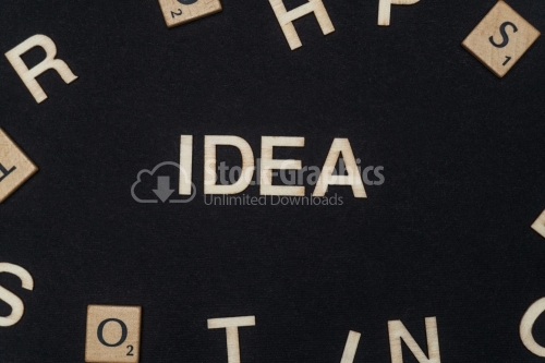 IDEA word written on dark paper background. IDEA text for your concepts