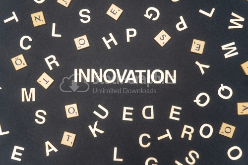 INNOVATION word written on dark paper background. INNOVATION text for your concepts