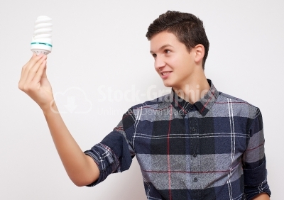 Isolated businessman holding light bulb bright idea