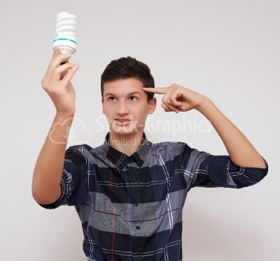 Isolated businessman holding light bulb bright idea