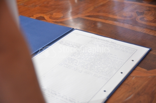 Italian marriage documents on wooden table