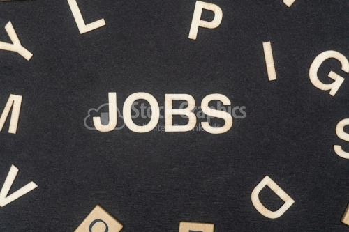 JOBS word written on dark paper background. JOBS text for your concepts