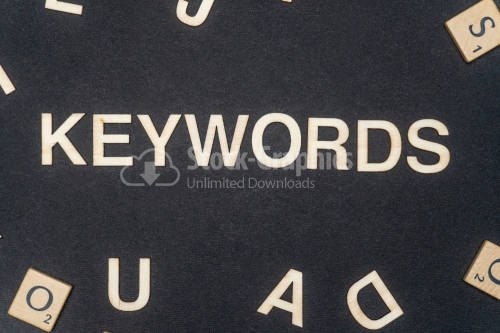 KEYWORDS word written on dark paper background. KEYWORDS text for your concepts