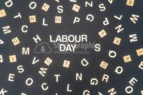 LABOUR DAY word written on dark paper background. LABOUR DAY text for your concepts