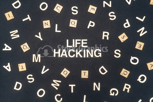 LIFE HACKING word written on dark paper background. LIFE HACKING text for your concepts