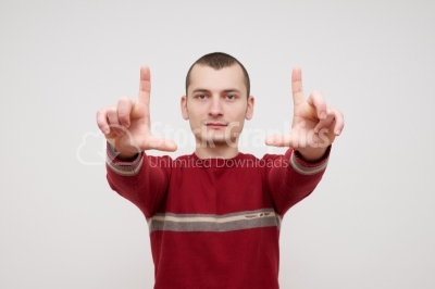 Male guy showing a loser sign