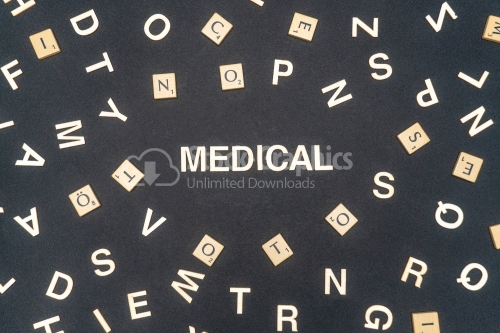 MEDICAL word written on dark paper background. MEDICAL text for your concepts