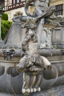 Men statue in the garden of Peles Castel Romania