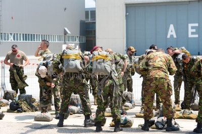 Military paratroopers preparing their bags for jumping