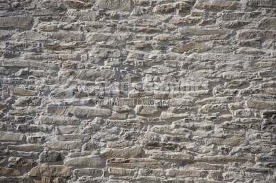Monochromatic background old stone wall narrow