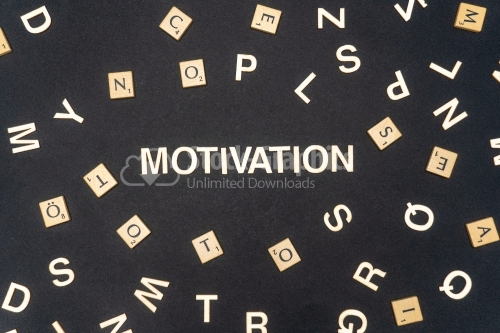 MOTIVATION word written on dark paper background. MOTIVATION text for your concepts