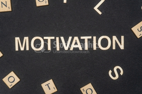 MOTIVATION word written on dark paper background. MOTIVATION text for your concepts
