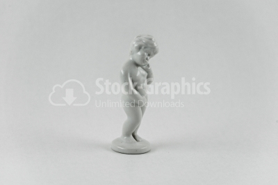 Naked kid porcelain statuette on white