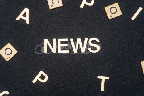 NEWS word written on dark paper background. NEWS text for your concepts