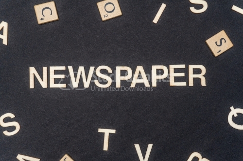 NEWSPAPER word written on dark paper background. NEWSPAPER text for your concepts