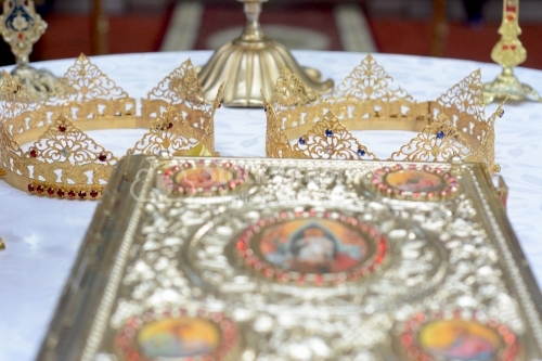 Objects for a orthodox wedding ceremony - the Holy Gospel, wedding crown. Country Romania. The Orthodox Church