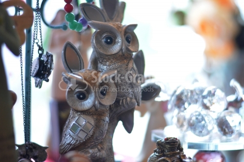 Owls statue, trinket as a decoration object on flat background.