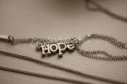 Pendant with word Hope closeup