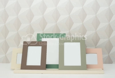 Photo frames on wooden table