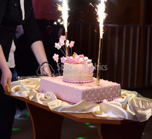Pink cake with fireworks