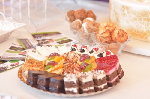 Platter with various cakes with cream in layers