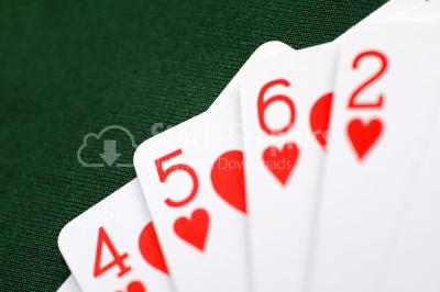Playing cards - isolated on green background