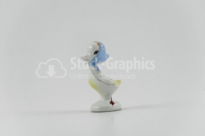 Porcelain duck girk on white background- Stock Image