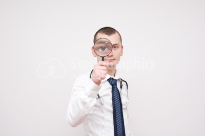 Portrait Of A Businessman With Magnifying Glass