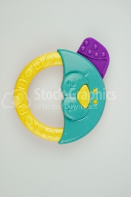 Rattle yellow and turquoise- Stock Image