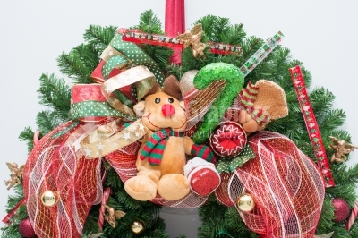 Reindeer mascot placed on christmas wreath
