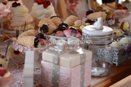 Rolls with crunchy chocolate and decorative jars around. Candy bar