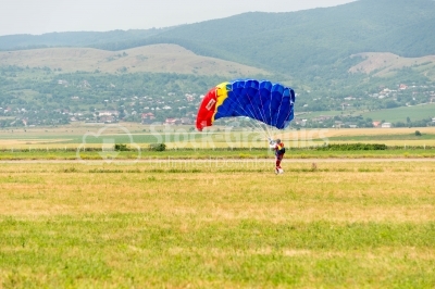 Romanian skydiver on the meadow