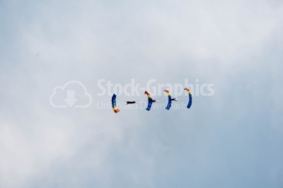 Romanian skydivers flying in a row