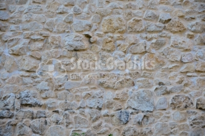 Rustic stone wall plastered on it