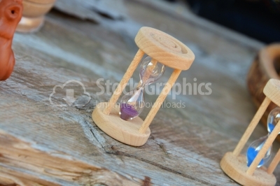 Sand clock lonely on a vintage table