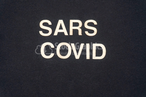 SARS COVID word written on dark paper background. SARS COVID text for your concepts