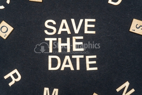 SAVE THE DATE word written on dark paper background. SAVE THE DATE text for your concepts