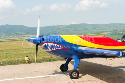 Sideway view of a coloured propeller plane