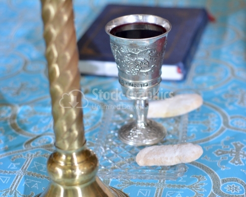 Silver holy chalice with red wine