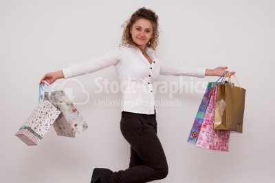 Smiling pretty woman with bags