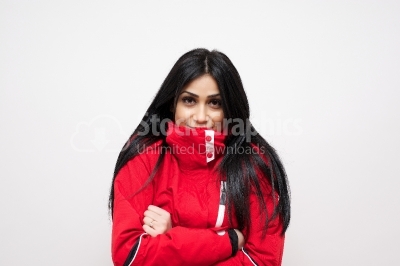 Smiling young woman in a red winter coat