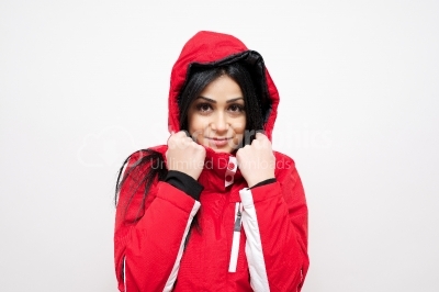 Smiling young woman in a red winter coat